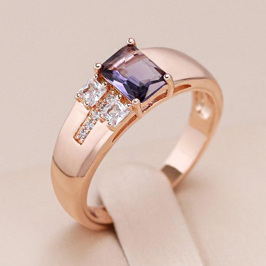 Rectangular ring in 18 carat pink gold with amethyst centre and small white zircons - AC