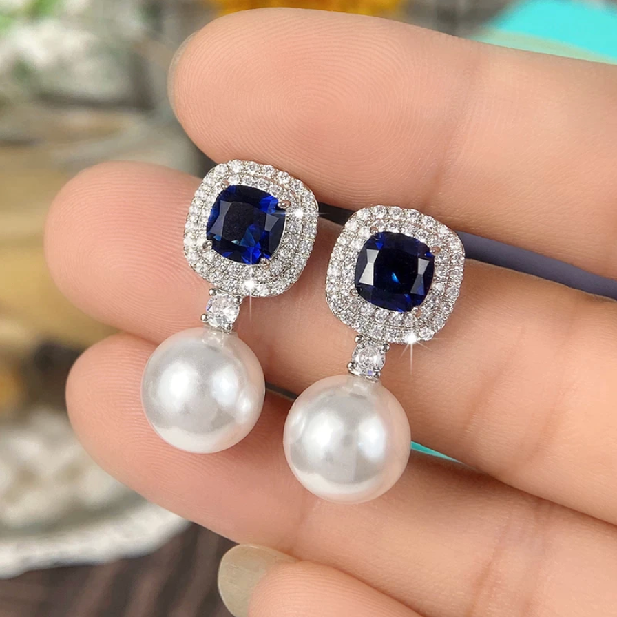 Earrings with shiny cubic zirconia and pearls