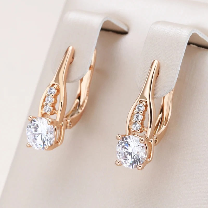 Hoop earrings with white zirconia in a row in 18K Rose gold plated