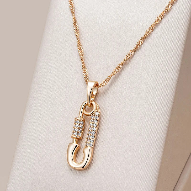 Pendant necklace with pin shape and zircons in 18K Rose Gold Plated