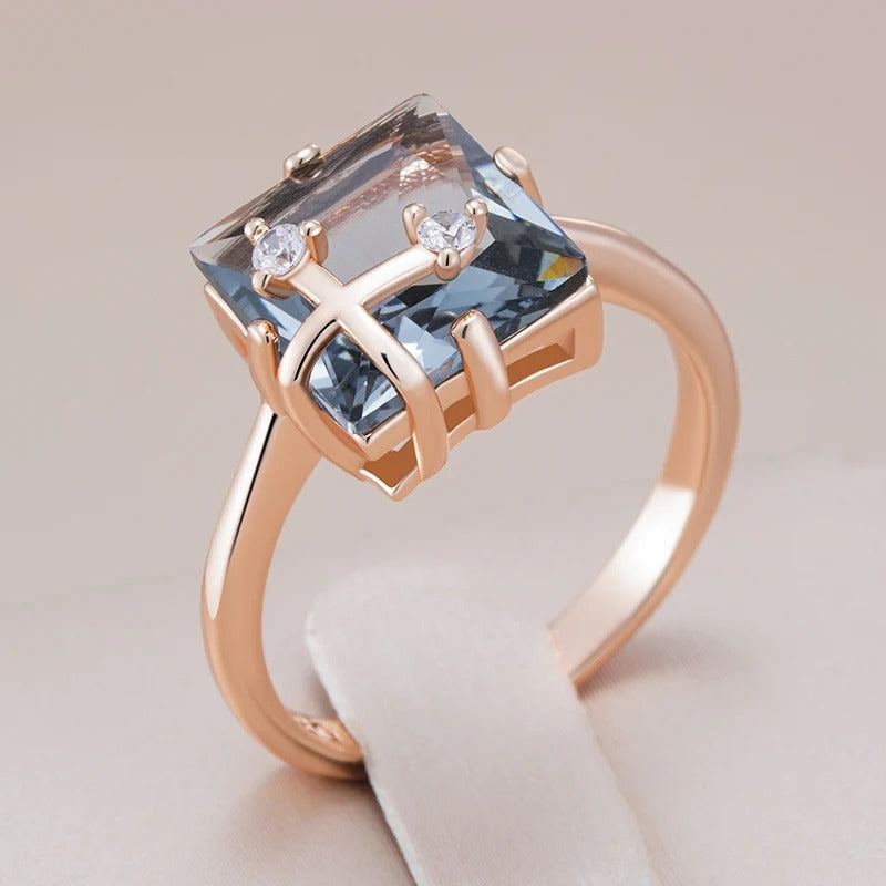 Classic ring with large rectangular grey shiny rectangular stone with zirconia in 18K rose gold plating