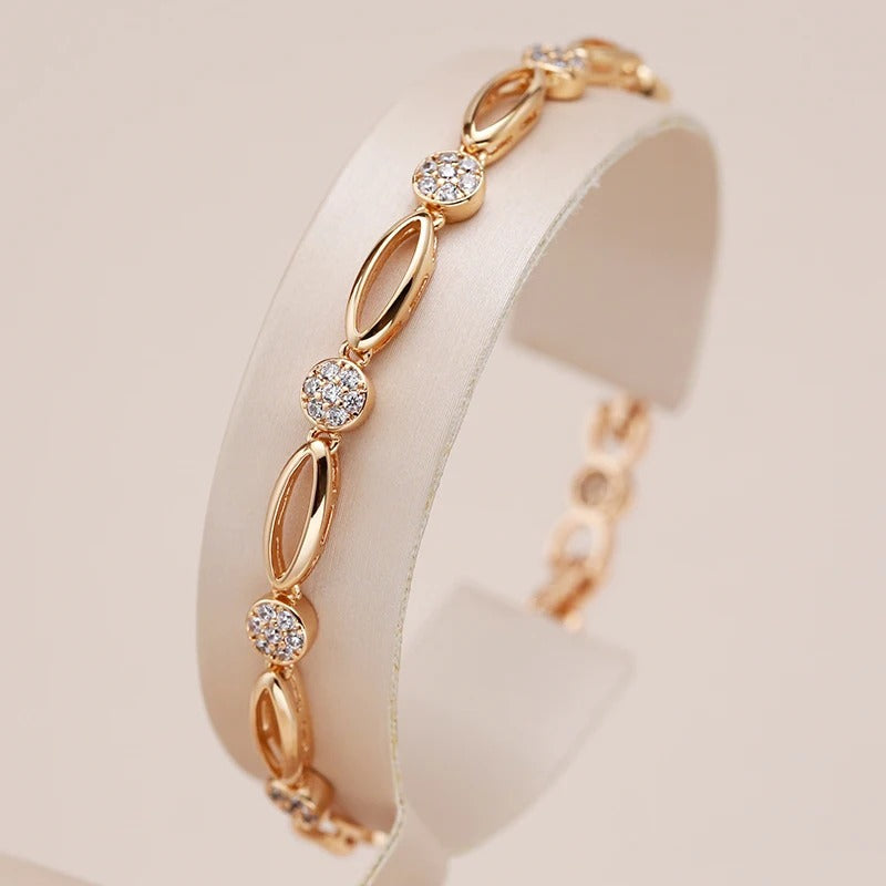 Fine bracelete of oval figures and white zirconias in 18K rose gold plating