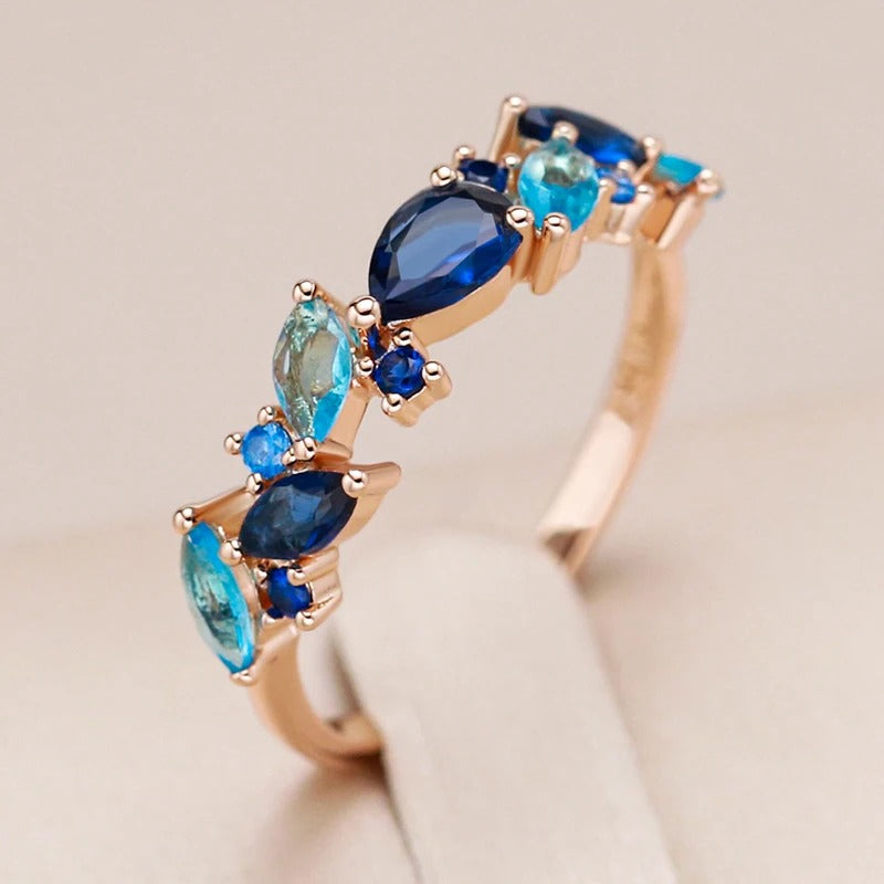 18kt gold-plated ring with marine stones, aquamarine zircons and sapphire - AC