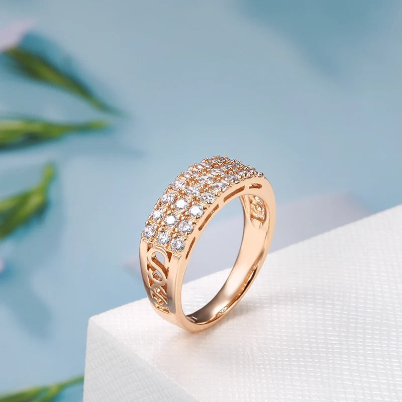 Ring in 18 carat pink gold with three rows of inlaid natural zircons - AC