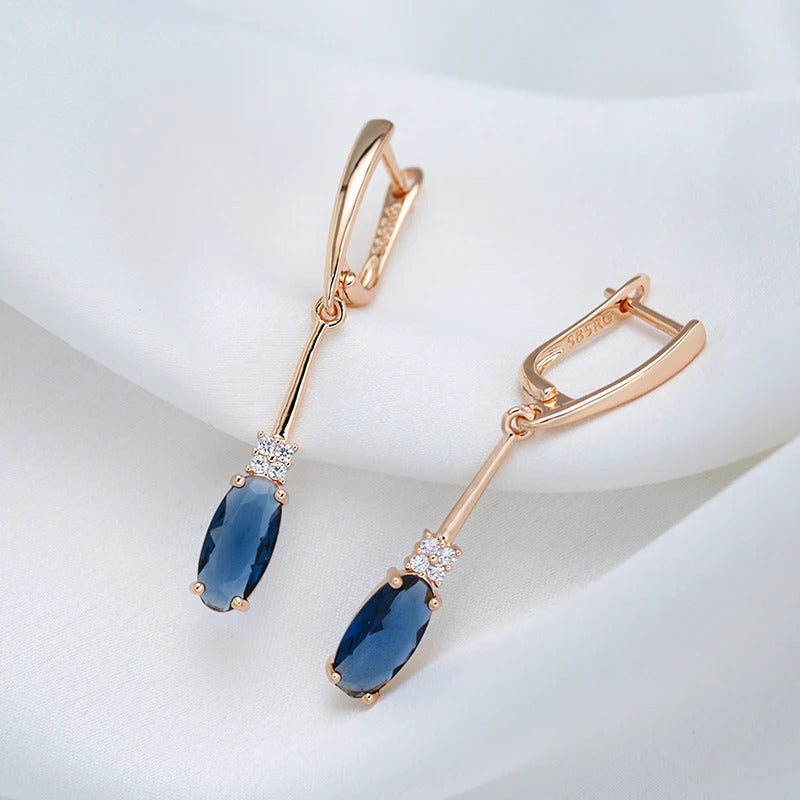 Long hoop earrings with sapphire cubic zirconia and white cubic zirconia in 18K Rose Gold Plating