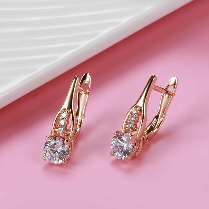 Hoop earrings with white zirconia in a row in 18K Rose gold plated