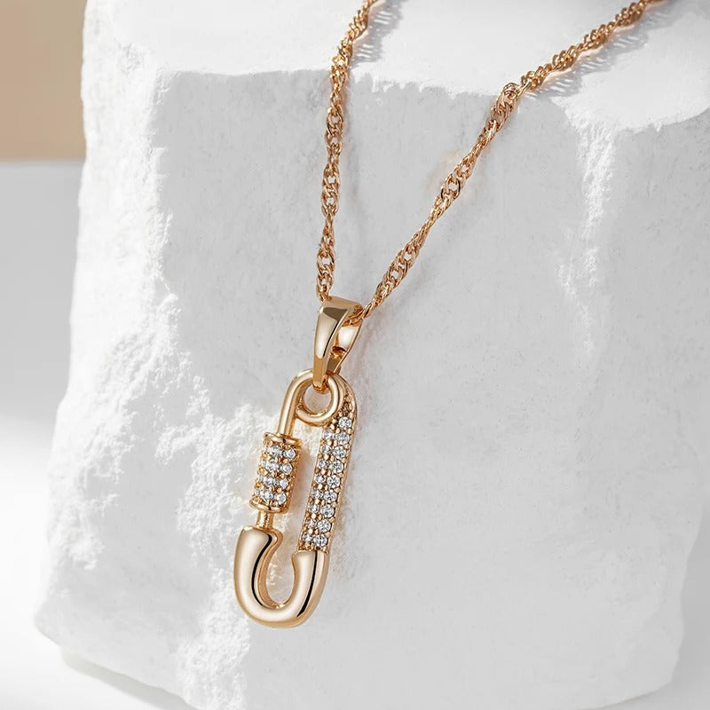 Pendant necklace with pin shape and zircons in 18K Rose Gold Plated