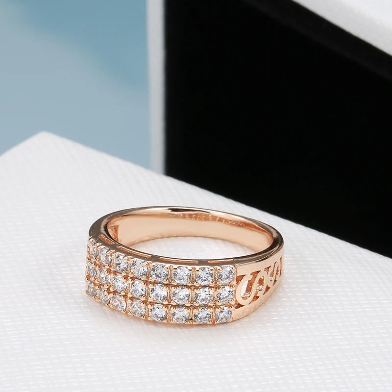 Ring in 18 carat pink gold with three rows of inlaid natural zircons - AC