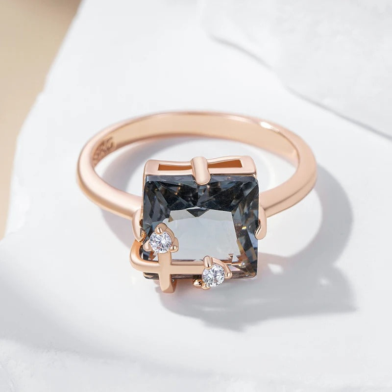 Classic ring with large rectangular grey shiny rectangular stone with zirconia in 18K rose gold plating