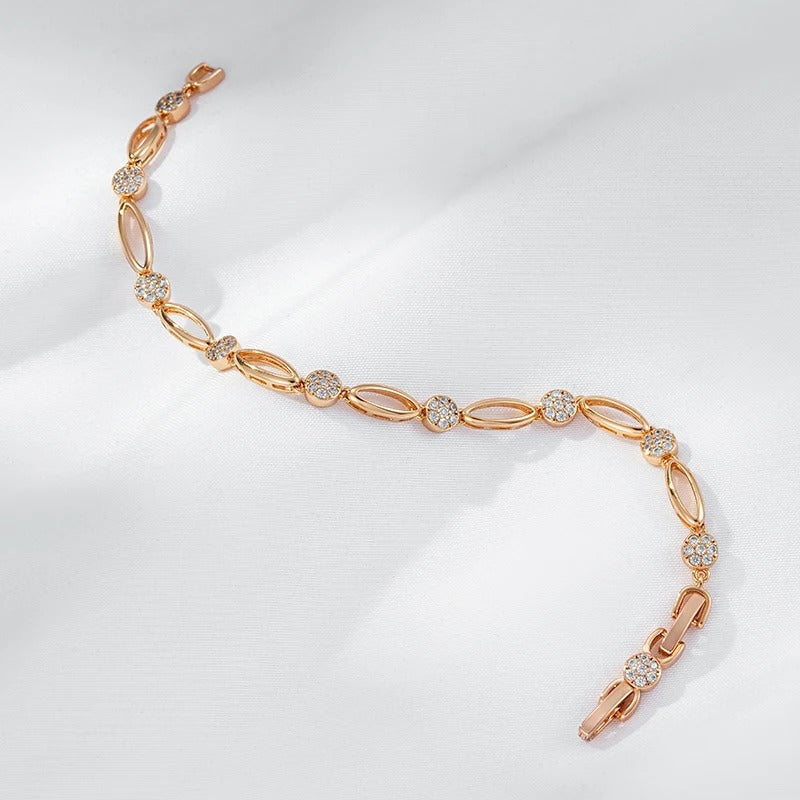 Fine bracelete of oval figures and white zirconias in 18K rose gold plating