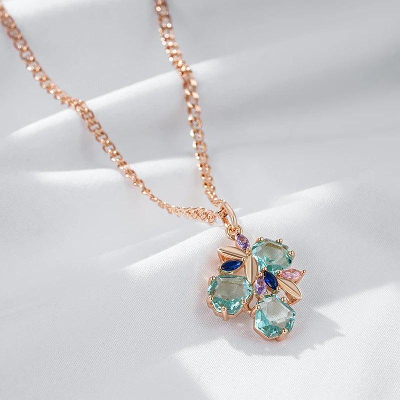 Necklace with tropical flower pendant with aquamarine zirconia and sapphire, amethyst and rose quartz in 18K rose gold plating