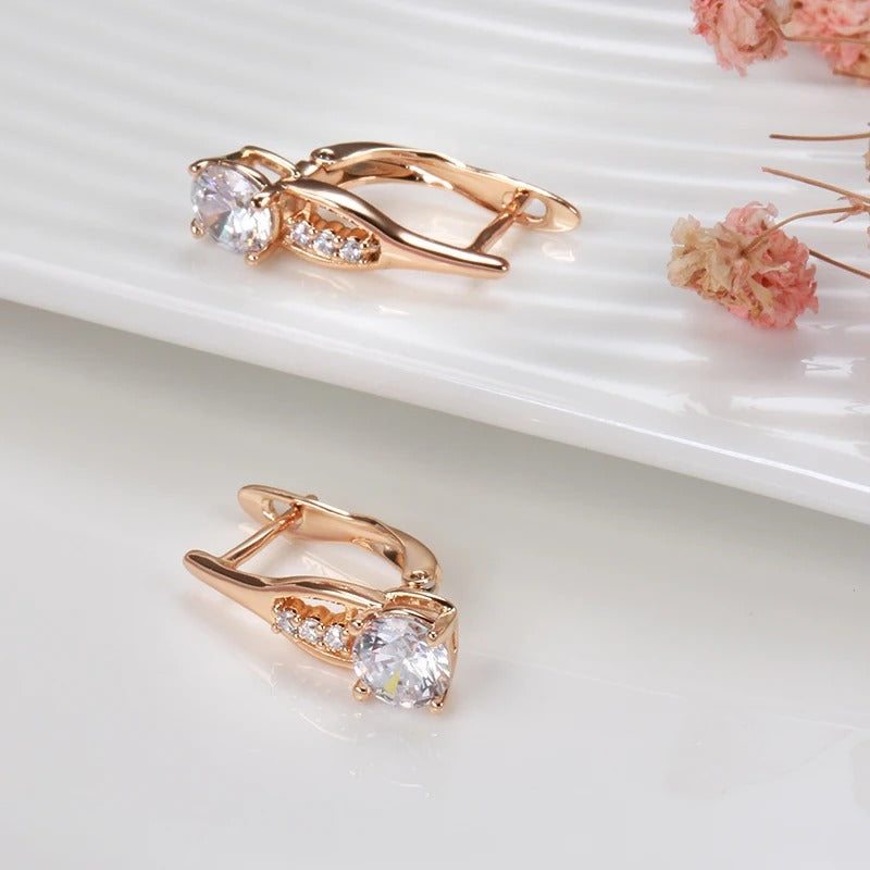 Hoop earrings with white zirconia in a row in 18K Rose gold plated