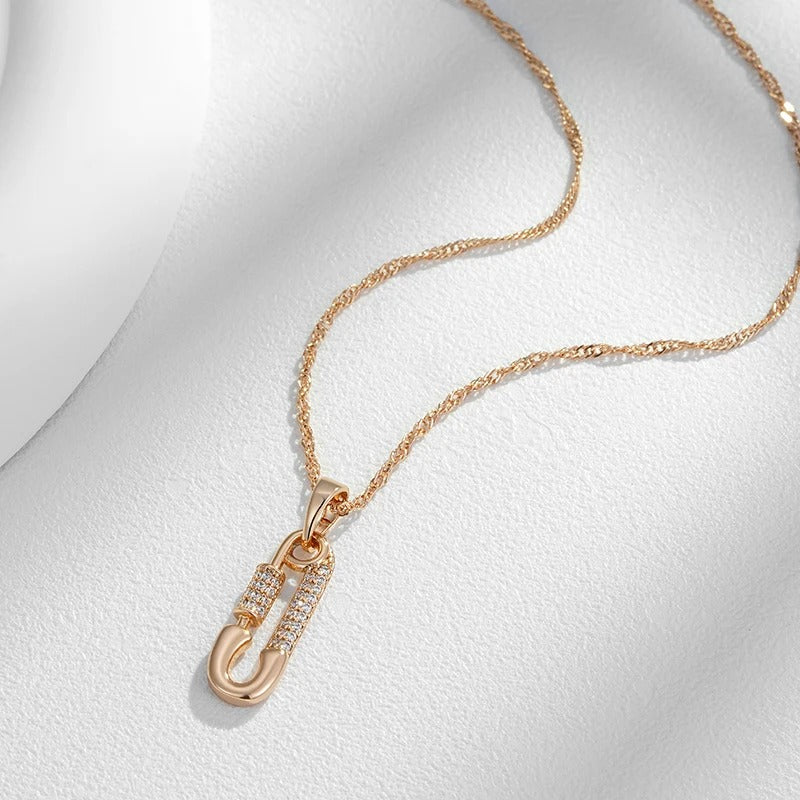 Pendant necklace with pin shape and zircons in 18K Rose Gold Plated