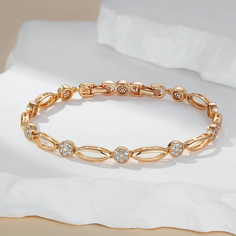 Fine bracelete of oval figures and white zirconias in 18K rose gold plating