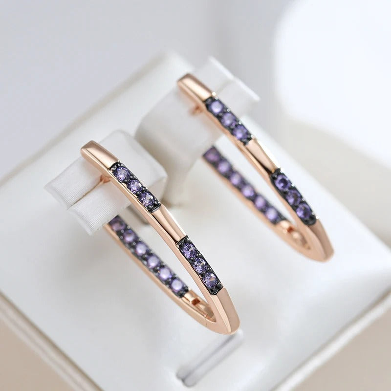 V-shaped geometrical earrings plated in 18 carat pink gold with purple cubic zirconia - AC