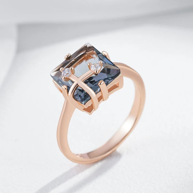 Classic ring with large rectangular grey shiny rectangular stone with zirconia in 18K rose gold plating