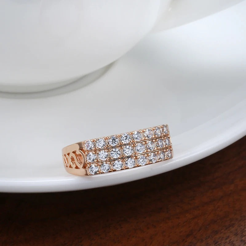 Ring in 18 carat pink gold with three rows of inlaid natural zircons - AC