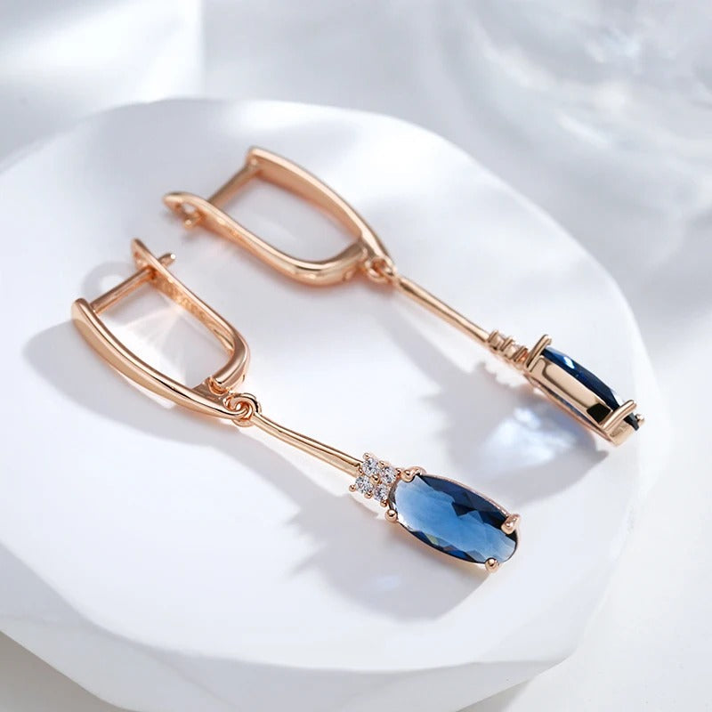 Long hoop earrings with sapphire cubic zirconia and white cubic zirconia in 18K Rose Gold Plating